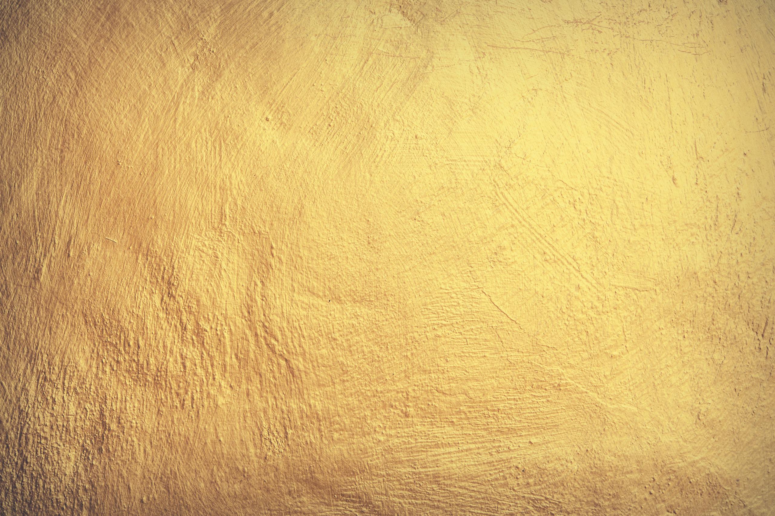 Hormita A vintage yellow stone wall texture perfect for wallpaper and design elements.