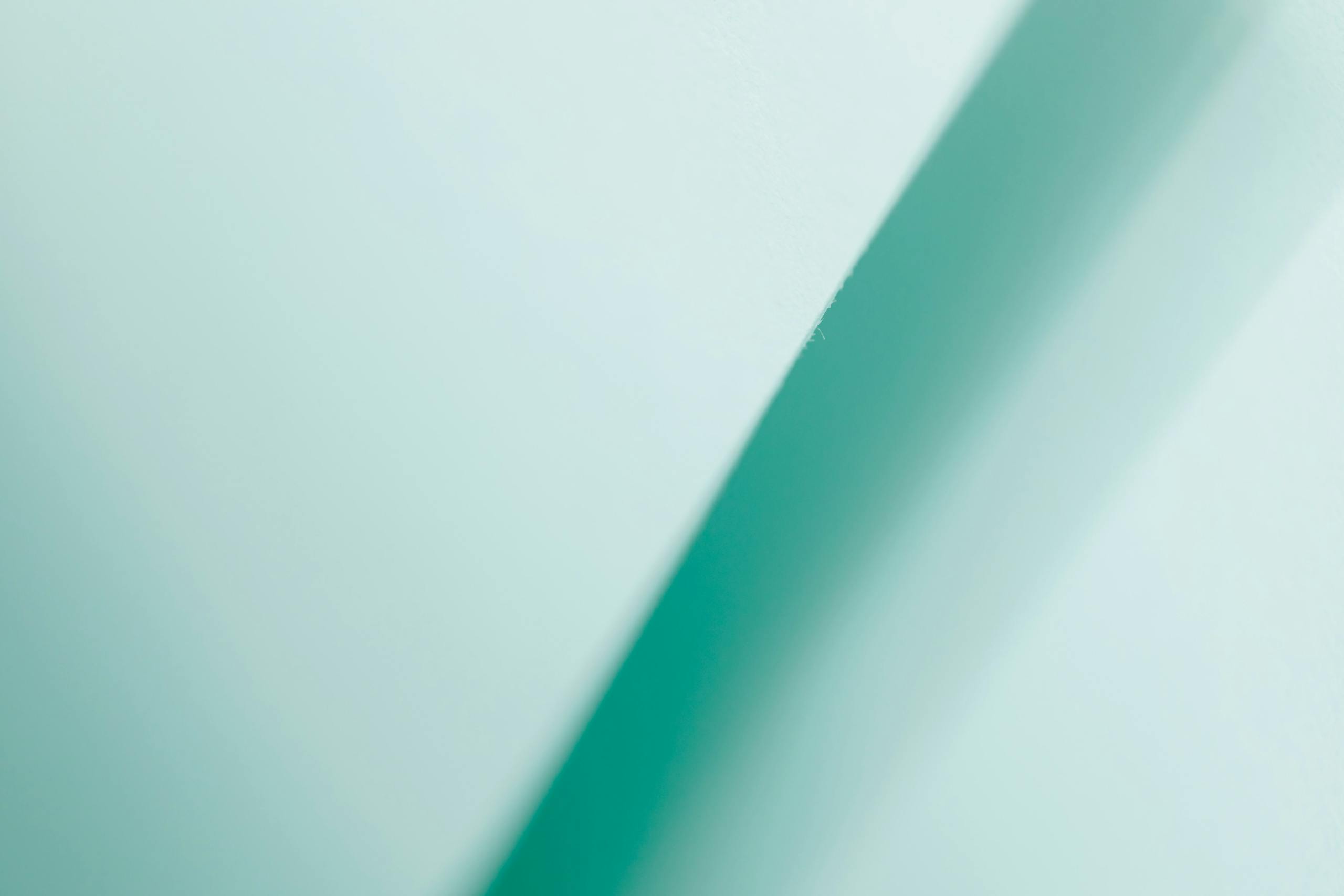 Emfyteymata Abstract turquoise gradient background featuring a diagonal line, perfect for modern design projects.