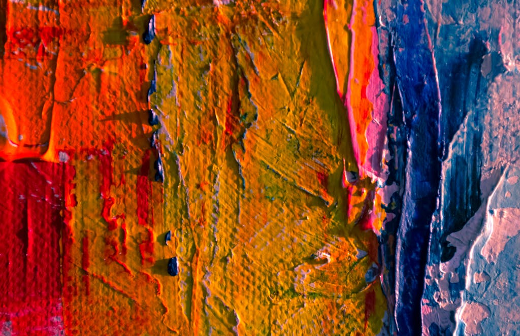 Messagenal Close-up of vibrant abstract acrylic paint textures with vivid colors.