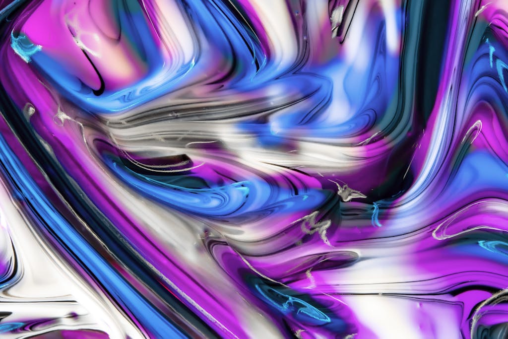 Kongotech OrgColorful abstract swirl with vibrant pinks, blues, and whites.