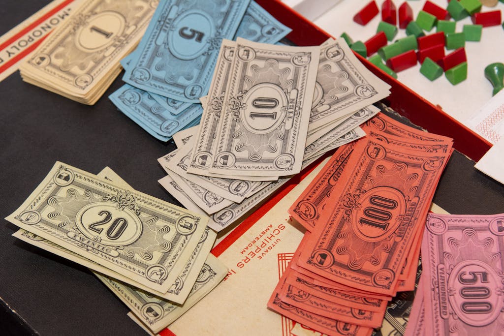 Florida Woman Wins Monopoly Lottery Colorful Monopoly money and game pieces arranged on a game board for a classic board game night.