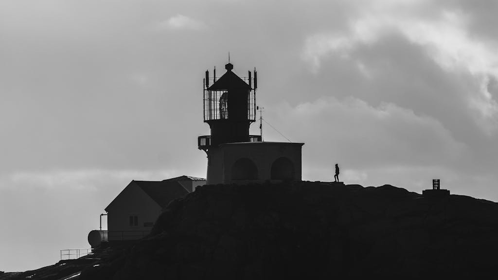 norsk casinowww.ribitup.com Silhouette of Lindesnes Lighthouse with dramatic sky, highlighting Norway's coastal allure.