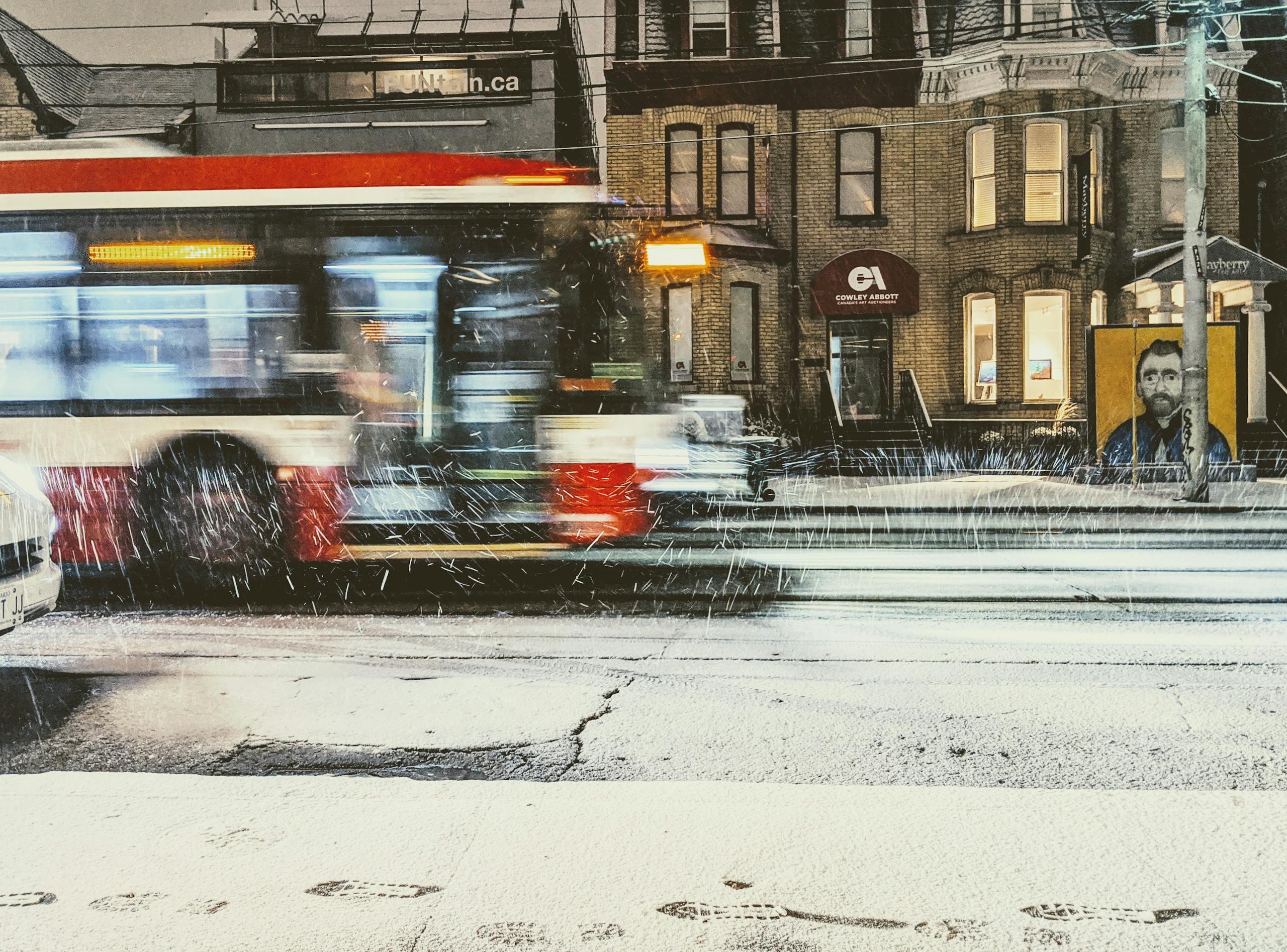Nueraji vs Crosbie Prediction Urban winter scene in Toronto featuring a blurred bus in motion on a snowy night.